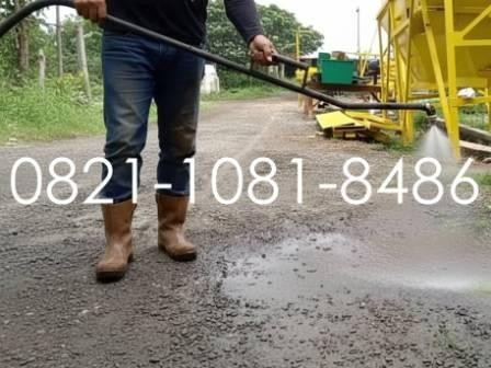 penyemprotan aspal cair dengan hand sprayer